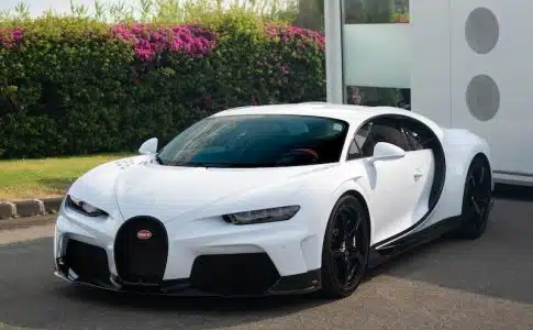 white lamborghini aventador parked near white concrete building during daytime